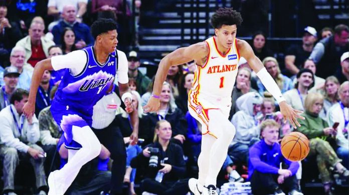 sports_Johnson.JPG_resized_compressed Atlanta Hawks forward Jalen Johnson (1) dribbles against Utah Jazz guard Ace Bailey (19). PHOTO COURTESY OF ROB GRAY-IMAGN IMAGES
