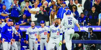 Will Smith celebrates with Los Angeles Dodgers teammates following his go-ahead homerun against Toronto Blue Jays. GETTY IMAGES