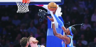 Oklahoma City Thunder guard Shai Gilgeous-Alexander shoots next to Portland Trail Blazers center Donovan Clingan and Thunder center Isaiah Hartenstein. AP