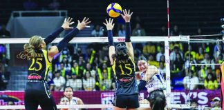 National University’s Sam Cantada rises for a kill against the University of Santo Tomas’ front line during Game 1 of the SSL Finals. SSL PHOTO