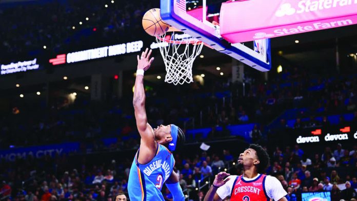 sports_OKC_resized_compressed Oklahoma City Thunder guard Shai Gilgeous-Alexander scores on a reverse layup. ESPN PHOTO