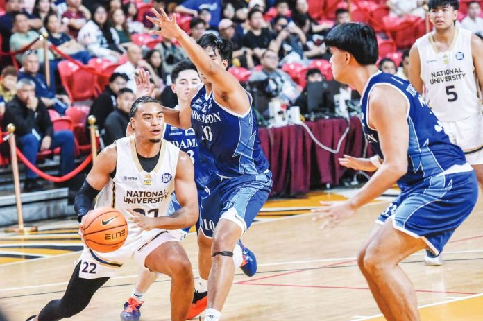 National University Bulldogs guard Mark Parks drives to the basket against Adamson University Falcons’ Cedrick Manzano during their UAAP Season 88 matchup. UAAP PHOTO