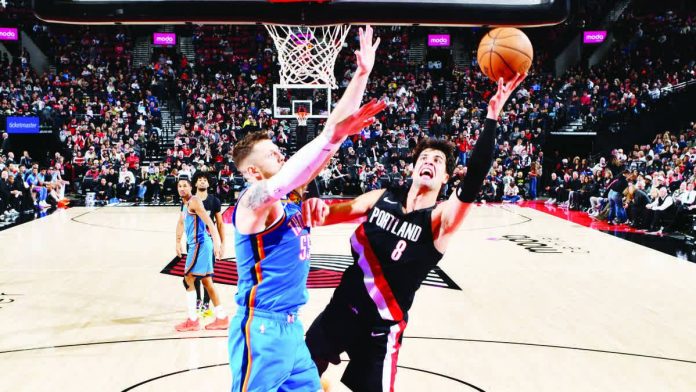 sports_Portland_resized_compressed Portland Trail Blazers forward Deni Avdija goes for a tough shot against the defense of Oklahoma City Thunder’s Isaiah Hartenstein. NBA PHOTO
