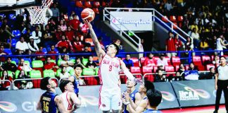 Ilonggo guard John Bryan Sajonia of the San Beda Red Lions attacks the rim against the JRU Heavy Bombers’ defense. NCAA PHOTO