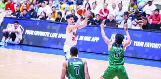 Rain or Shine Elasto Painters’ Leonard Santillan hoists a three-pointer against the defense of Terrafirma Dyip’s Mark Sangalang. PBA PHOTO