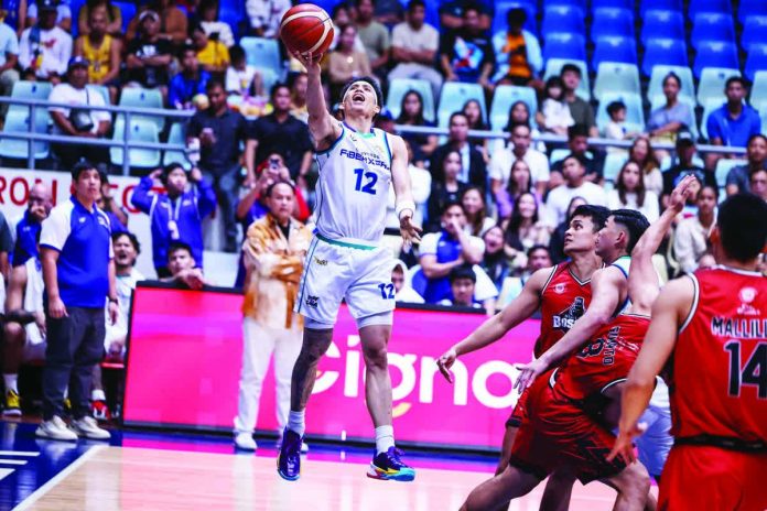 sports_Stockton_resized_compressed Converge FiberXers guard Alec Stockton drives for a layup against Blackwater defenders. PBA PHOTO