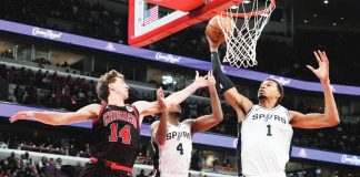 San Antonio Spurs center Victor Wembanyama (1) rebounds a ball against Chicago Bulls forward Matas Buzelis (14). PHOTO COURTESY OF NAM Y. HUH/AP