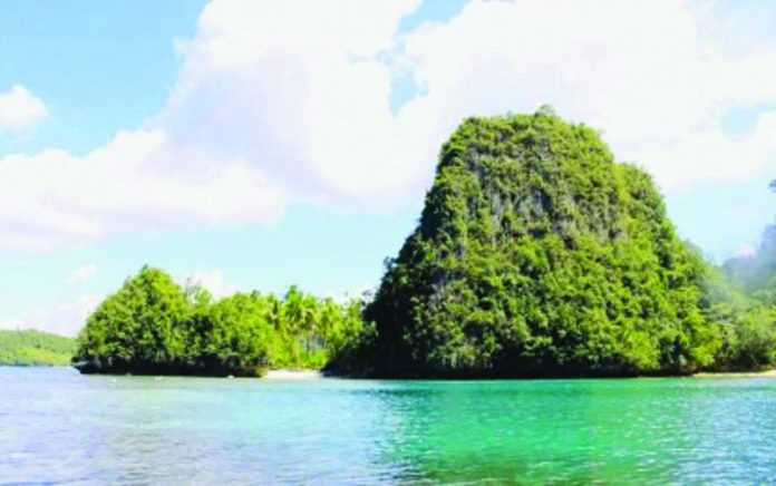 A pristine cove in the Dinagat Islands is shown in this undated photo. The province's untouched landscapes have caught the attention of producers from the internationally acclaimed reality series “Survivor”, who will scout locations for a potential new season in December. DINAGAT ISLANDS TOURISM AND CULTURE OFFICE PHOTO