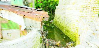 The illegal fencing in Sulom Creek, Barangay Villamonte, Bacolod City obstructs the flow of water, causing flooding and posing risks to residents living near the property. MAYOR GREG GASATAYA FB PHOTO