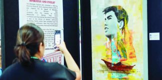 A painting of the late Gov. Evelio “Beloy” B. Javier by artist Jan Frederick Grafane stands prominently on display at the Binirayan Art Exhibit in the Old Provincial Capitol, drawing festival-goers and history enthusiasts alike. PROVINCE OF ANTIQUE PHOTO
