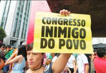 People gather during a demonstration to oppose the sentence-reduction bill, known as PL da Dosimetria, that could pave the way for former Brazilian President Jair Bolsonaro's amnesty, in Sao Paulo, Brazil, on December 14, 2025. Some protesters held up signs denouncing members of Congress as "enemies of the people." GETTY IMAGES