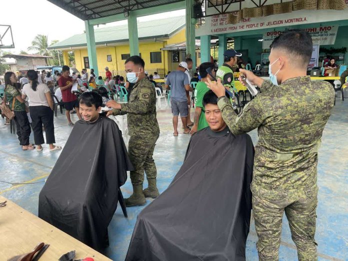 PH_Army_bloodletting_resized_compressed Members of the 552nd Engineer Construction Battalion provided free haircut service to residents during the community bloodletting activity in Barangay Jelicuon, Cabatuan, Iloilo, held in celebration of the AFP Anniversary on December 7. CMO TEAM PHOTO