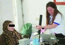 A registration officer captures the front-facing photo of a registrant during the National ID registration at Manoc-Manoc Covered Court in Boracay, Malay, Aklan. PSA-AKLAN PHOTO