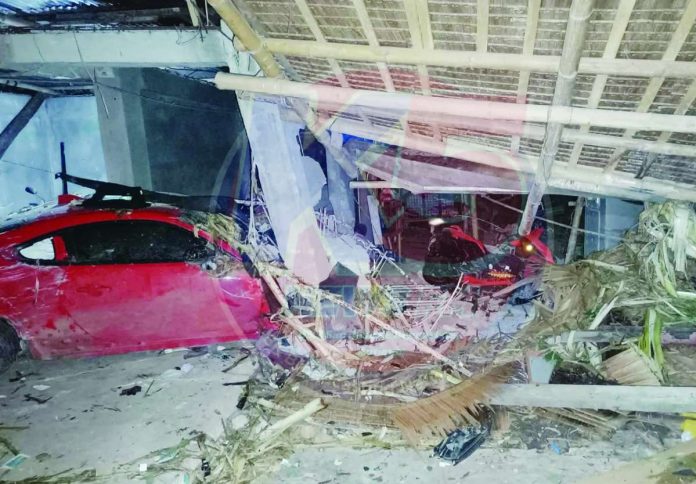 antique accident_compressed A car crashed into a garage of a house in Barangay Rombang, Sibalom, Antique after the driver tried to avoid running over a dog that suddenly crossed the street. K5 ANTIQUE UPDATES/FACEBOOK PHOTO