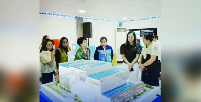 energy facilities_superimposed_compressed Energy Secretary Sharon Garin (second from right) says the Department of Energy (DOE) is hoping that by 2026 they can design one city that is a typhoon-prone area. The DOE on December 1 opened an exhibit showing models of various power generation facilities using different technologies. DOE PHOTO