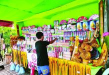 AVOID BANNED CRACKERS; Sellers, buyers face charges, fines – PRO-6 A vendor starts displaying and selling firecrackers at his stall in Barangay Buhang, Jaro, Iloilo City. The Police Regional Office 6 advised the public to purchase and use only certified Philippine Standard fireworks and firecrackers from registered retailers and dealers. Photo courtesy of AJ Palcullo/PN