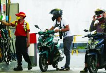 Fuel prices seen to roll back ahead of Christmas A gasoline station attendant in Quezon City assists motorcycle riders as vehicle owners start queuing to fill their tanks. Fuel prices are expected to go down next week ahead of the Christmas break. LYN RILLON/INQUIRER.NET FILE PHOTO