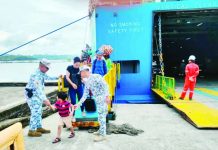 HOLIDAY WATCH AT THE PORTS. Philippine Coast Guard personnel assist and monitor passengers as holiday travelers disembark and queue at ports in Western Visayas, part of heightened security and safety measures being enforced amid the surge of sea travel ahead of Christmas and New Year. PCG Photo