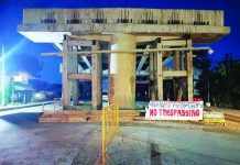 A warning banner declaring “Private Property – No Trespassing” is displayed beneath the Aganan Flyover in Pavia, Iloilo as the Jamotillo family escalates its right-of-way dispute with the Department of Public Works and Highways and the contractor, threatening to block the road if payment delays persist. AJ PALCULLO/PN