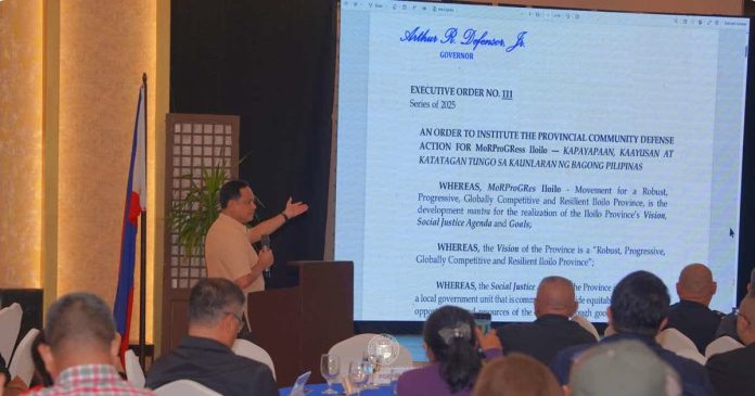 ime_peace_resized_compressed Gov. Arthur Defensor Jr. presents Executive Order No. 111, Series of 2025, instituting the Provincial Community Defense Action for MoRProGRes Iloilo, during the Provincial Peace and Order Council special meeting on December 23, 2025 as the province adopts an integrated framework on peace, security, and resilience. PHOTO FROM BALITA HALIN SA KAPITOLYO