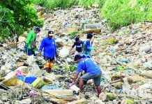 ‘Dumping fears rise as refrigerator casings, industrial junk found in Jaro River tributary’ Iloilo City Hall workers and community volunteers wade through mounds of mixed waste — including refrigerator casings and suspected junk shop discards — during a cleanup at a tributary of the Jaro River in Barangay Cubay, Jaro, Iloilo City. Authorities say the volume and type of trash point to possible illegal dumping, which threatens to obstruct waterways and worsen flooding in surrounding communities. GSO PHOTO