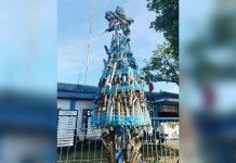 Muffler Christmas Tree: A bold showcase of art and law enforcement DULL TO THE EYE BUT RICH IN MEANING. Sagay Component City Police Office’s unique Christmas tree is adorned with seized noisy mufflers and fake driver’s license cards, symbolizing law enforcement and public awareness. SCCPO PHOTO