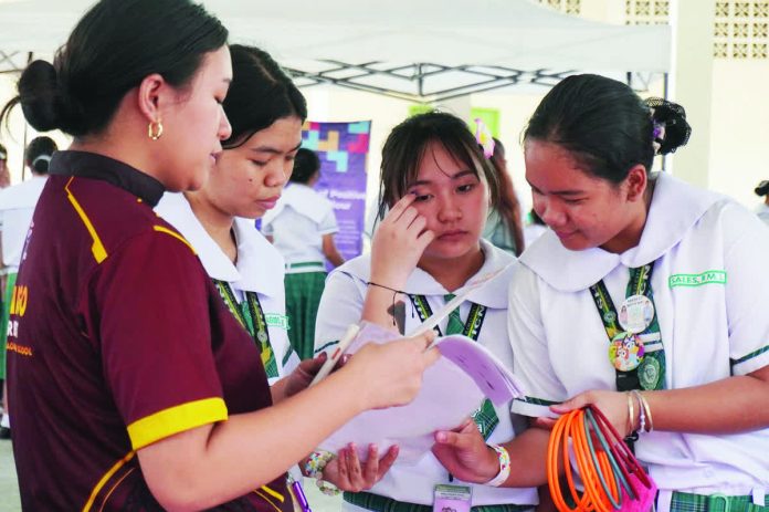 neljoy_cyber_copy_resized_compressed Students take part in an interactive digital safety activity during the launch of the Cyber Caravan at Iloilo City National High School in Molo, Iloilo City where government agencies and partners taught learners how to recognize online risks, protect personal information, and practice responsible digital behavior. DSWD-6 PHOTO
