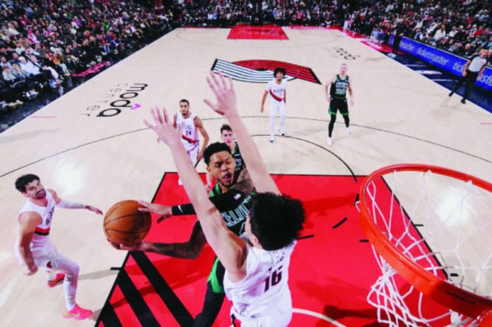 portland_snaps_resized_compressed Portland Trail Blazers center Yang Hansen foils the shot attempt of Boston Celtics guard Anfernee Simons. GETTY IMAGES