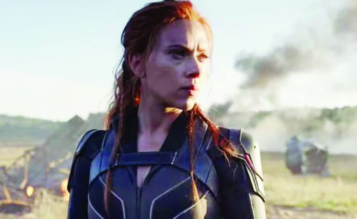 This image released by Disney/Marvel Studios’ shows Scarlett Johansson in a scene from “Black Widow.” MARVEL STUDIOS/DISNEY VIA AP
