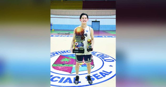 Paul Adrian Barcelona proudly holds the championship trophy and his Finals MVP award after leading Bacolod Tay Tung High School to the title in the Iloilo 1st Governor’s National Cup at the Iloilo Sports Complex. CONTRIBUTED PHOTO