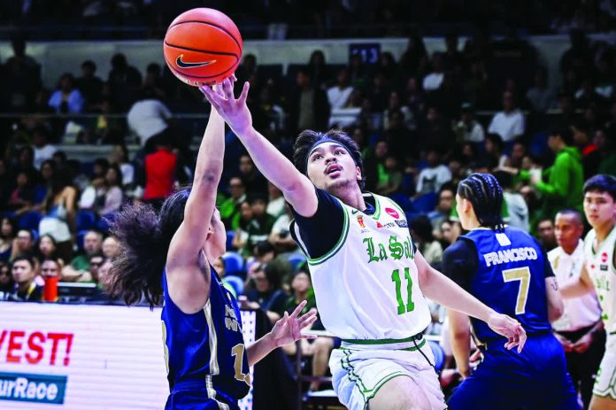 sports_DLSU_resized_compressed De La Salle University Green Archers’ Jacob Cortez attacks the defense of National University Bulldogs guard Steve Nash Enriquez for a layup. UAAP PHOTO