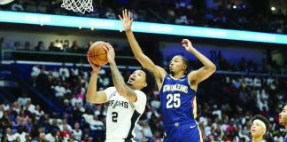 Filipino-American guard Dylan Harper of San Antonio Spurs shoots a layup against New Orleans Pelicans forward Trey Murphy III. AP