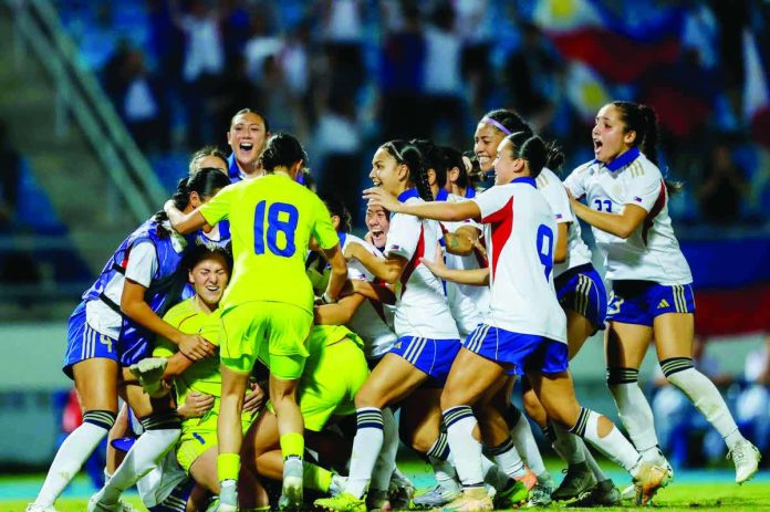 sports_Filipinas_resized_compressed Members of Philippine women’s football team celebrates after goal keeper Olivia McDaniel made a game-winning save against Vietnam. PHOTO COURTESY OF POC MEDIA POOL