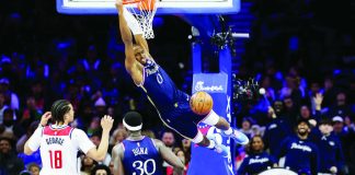 Philadelphia 76ers guard Tyrese Maxey soars for a two-handed dunk. GETTY IMAGES