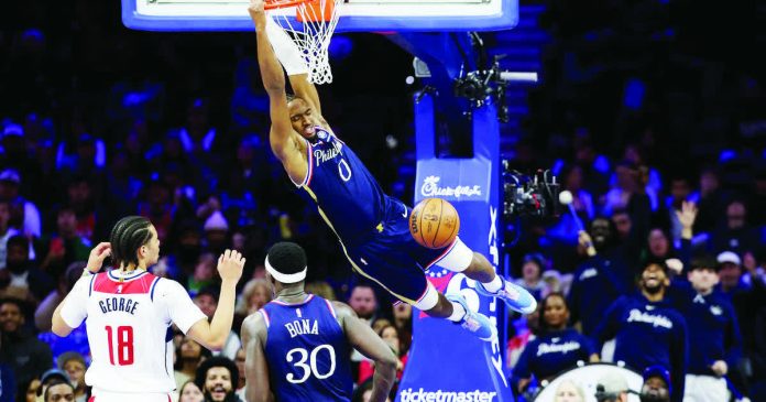 sports_NBA_resized_compressed Philadelphia 76ers guard Tyrese Maxey soars for a two-handed dunk. GETTY IMAGES