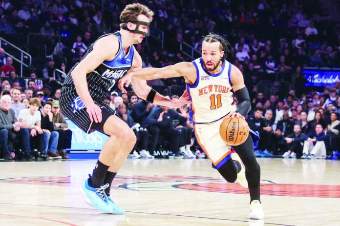 sports_NBA_resized_compressed New York Knicks guard Jalen Brunson (11) looks to drive past Orlando Magic forward Franz Wagner (22) in the first quarter at Madison Square Garden. WENDELL CRUZ-IMAGN IMAGES