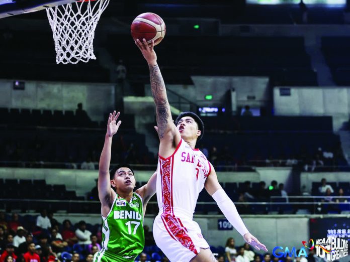 sports_San_Beda_resized_compressed Ilonggo John Bryan Sajonia of the San Beda Red Lions drives to the basket during their Final Four clash against the CSB Blazers. NCAA PHOTO