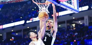 San Antonio Spurs center Victor Wembanyama dunks over the defense of Oklahoma City Thunder's Jalen Williams. NBA PHOTO