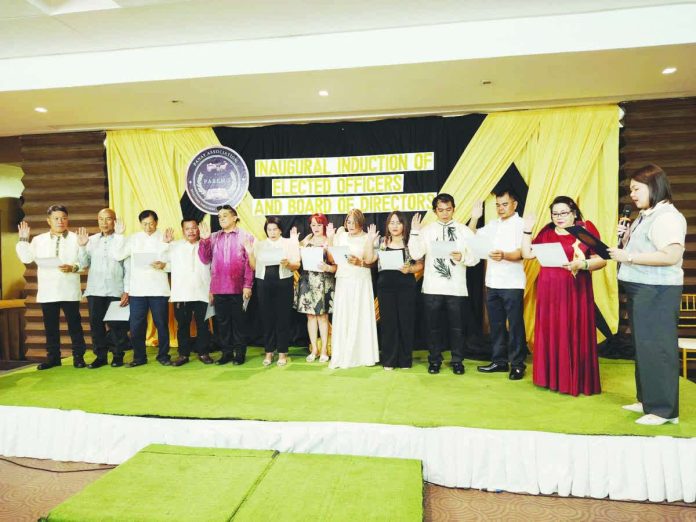 3_resized_compressed Mayor Raisa Treñas (rightmost) administers the oathtaking ceremony of the newly elected officers of Panay Association of Registered Embalmers and Mortuary Owners.