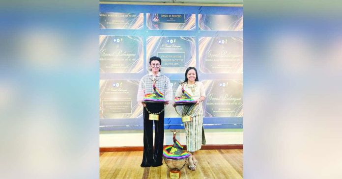Aklanons gawad balangaw copy_superimposed_compressed AWARDEES IN CULTURE AND THE ARTS. Awardees from the Province of Aklan—Sheree R. Reynaldo (right) and Errol Ordinez (left), president of the Aklan Historical and Cultural Society, Inc.—posed for a photo during the 1st Gawad Balangaw: Regional Awards for Culture and the Arts at the DepDev Regional Office in Iloilo City. ERROL ORDINEZ FB PHOTO