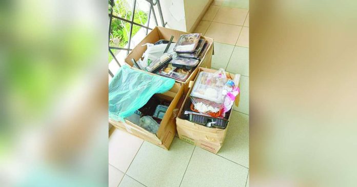 Bacolod ban caterers copy_superimposed Three boxes containing spoiled food packs were shown after the Bacolod City Government Employees’ Union (BCGEU) confirmed that more than 1,100 meals served during the December 19, 2025 Year-End Assessment and Employees’ Day celebration at the Bacolod City Government Center went bad, prompting the union to impose a two-year ban and monetary sanctions on two caterers involved in the incident. MAE SINGUAY/PN