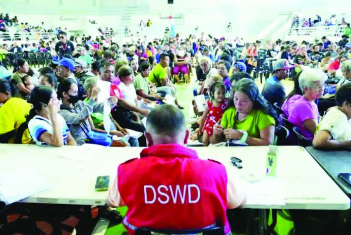 Beneficiaries lined up to receive Emergency Cash Transfer assistance during the first payout batch for families affected by Typhoon “Tino” in Bacolod City. The city government is seeking additional funds from the Department of Social Welfare and Development to cover households left out of the initial distribution. BACOLOD-STONGER TOGETHER FB PHOTO