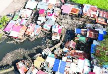 Bacolod seeks P6-B for flood mitigation; SP urges mapping of student flood routes Aerial view of the 27 structures along Mambuloc Creek in Purok Balinday, Barangay 2, prior to their voluntary dismantling on January 15 following an order from the Bacolod City government, as part of ongoing construction and repair works to mitigate flooding in the area. BACOLOD-STRONGER TOGETHER FB PHOTO