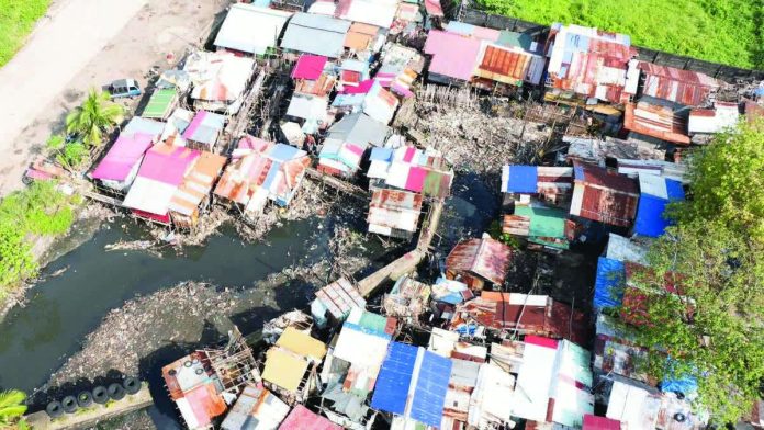 Bacolod_creekside_structures_copy_resized_resized_compressed Aerial view of the 27 structures along Mambuloc Creek in Purok Balinday, Barangay 2, prior to their voluntary dismantling on January 15 following an order from the Bacolod City government, as part of ongoing construction and repair works to mitigate flooding in the area. BACOLOD-STRONGER TOGETHER FB PHOTO