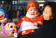 China’s birth rate hits record low as population continues to shrink A Chinese woman is laughing while holding a baby girl. China’s birth rate fell to 5.63 per 1,000 people – a record low since the Communist Party took power in 1949. AFP VIA GETTY IMAGES