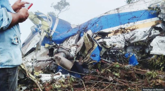 Colombia_copy_resized A person stands near the wreckage of a plane crash in Playa de Belen, North Santander, Colombia. REUTERS