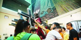 A devotee touches an image of Jesus Nazareno at Quiapo Church in Manila on Jan. 7, 2026, two days before the annual Traslacion. Millions are expected to attend the Nazareno feast on Jan. 9. PNA
