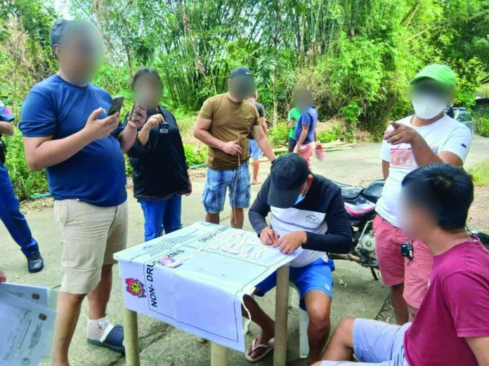 Family_driver_resized_resized_compressed Police officers conduct a drug buy-bust operation along a roadside in Barangay Devera, Sara, Iloilo on January 14, 2026, leading to the arrest of a barangay captain and the seizure of nearly P6.46 million worth of suspected shabu. The operation was carried out by the Police Drug Enforcement Unit following surveillance and intelligence work. IPPO PHOTO