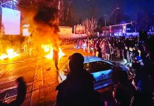 Iran warns of counterstrike if US Attacks; hundreds killed in protests Protesters gathered in a street in Tehran, Iran and set on fire some properties. MAHSA / MIDDLE EAST IMAGES / AFP VIA GETTY IMAGES