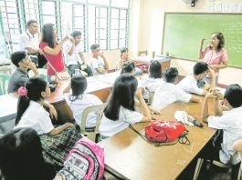 Over 10 towns suspend classes, school work to honor teachers A teacher at Ramon Magsaysay (Cubao) High School in Quezon City listens to concerns raised by her students during the start of classes in this photo taken in 2018. INQUIRER PHOTO